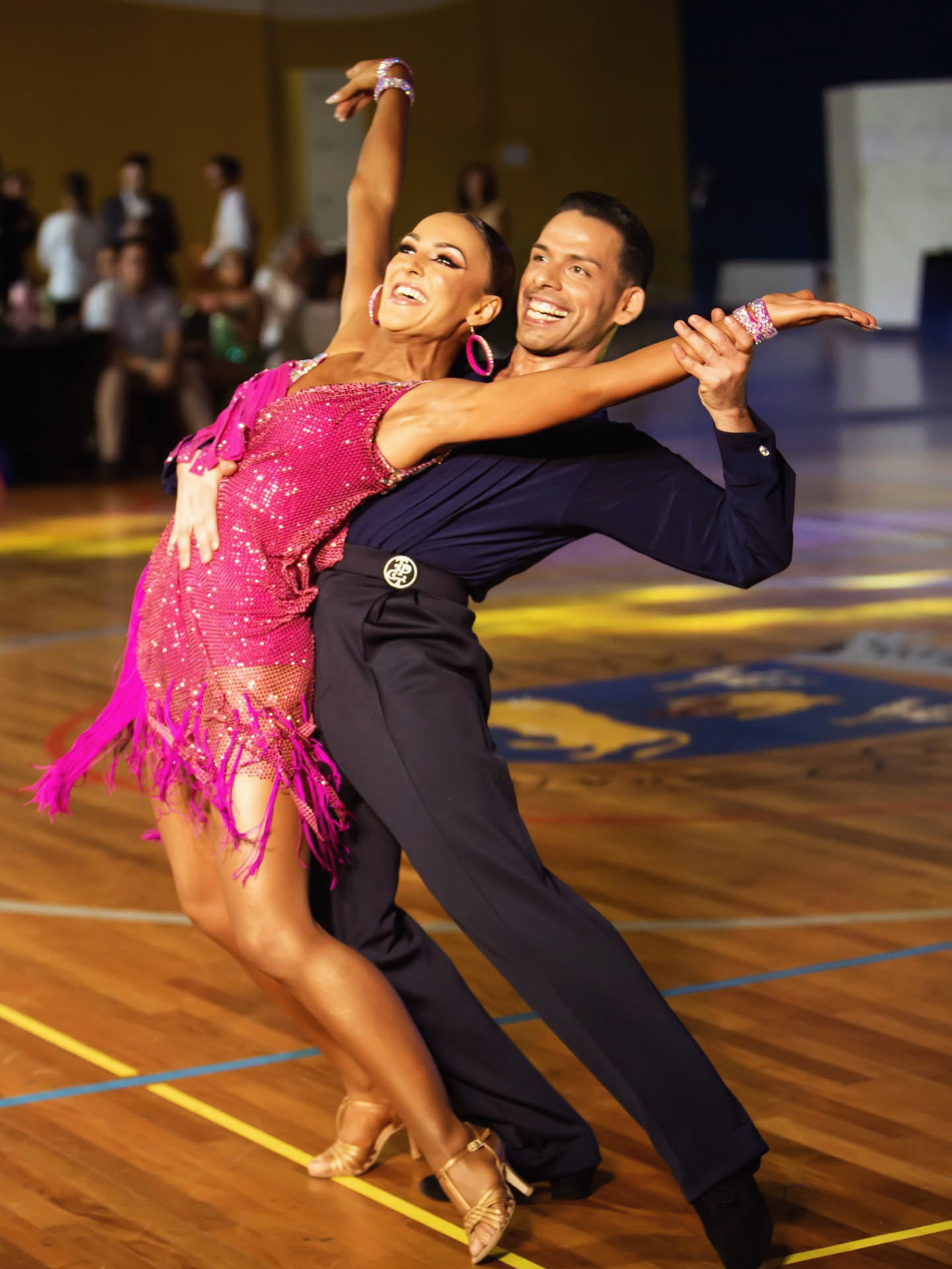 Christina Katsaros smiling during a Latin dance performance